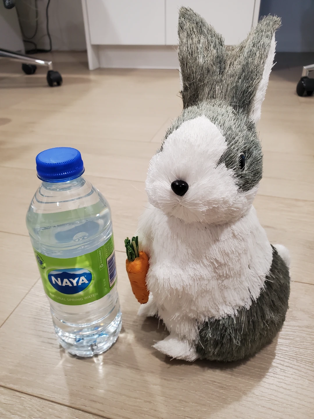 Decor Grey and White Rabbit Holding a Carrot