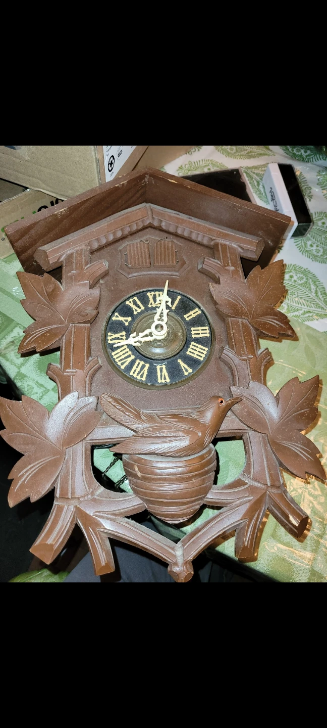 Brown Cuckoo Clock with Bird and Nest Design