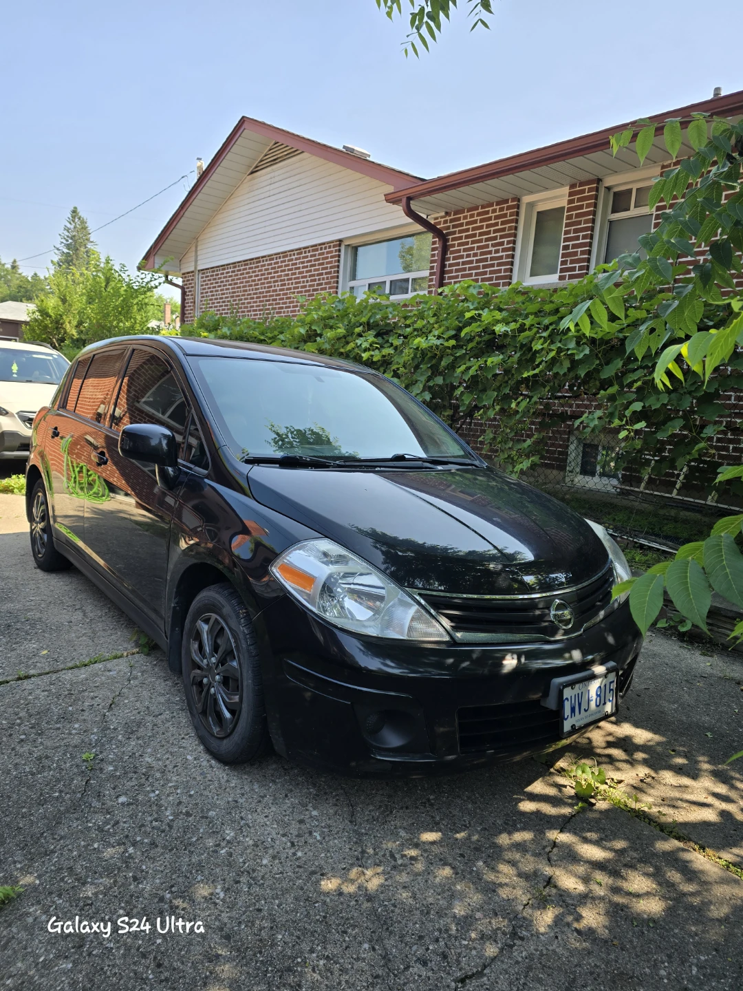 Black Nissan Versa Hatchback - photo 3