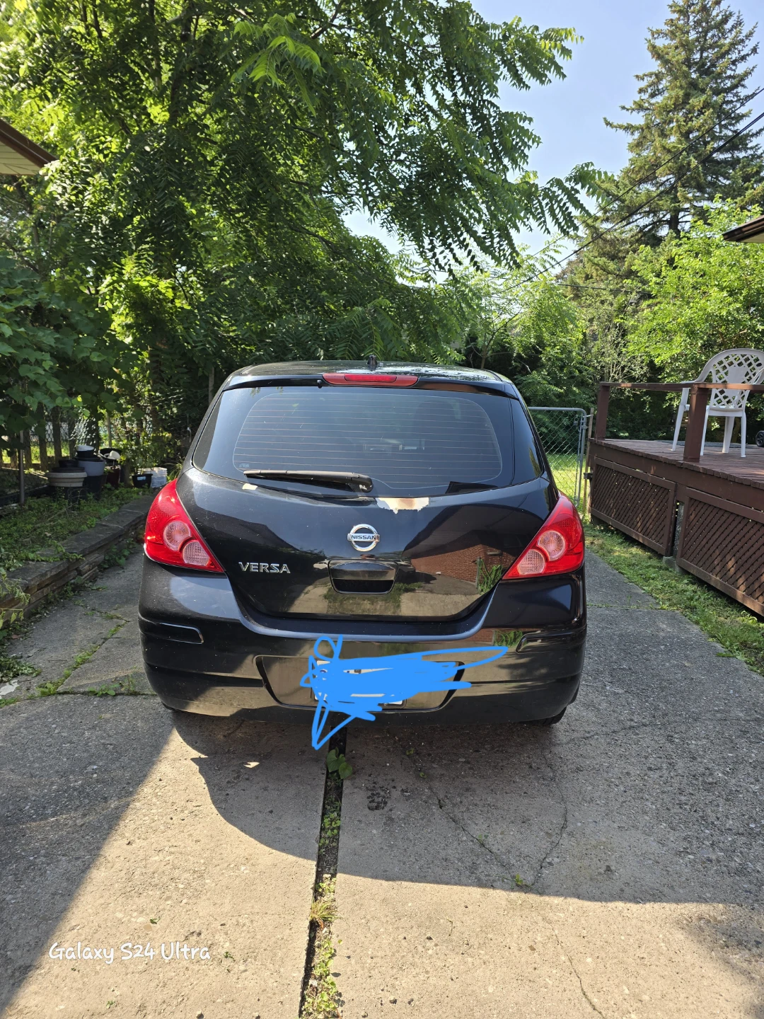 Black Nissan Versa Hatchback - photo 4