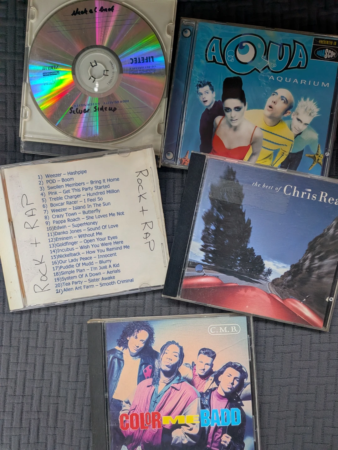 CD Lot: Aqua, Chris Rea, Weezer, Color Me Badd & More
