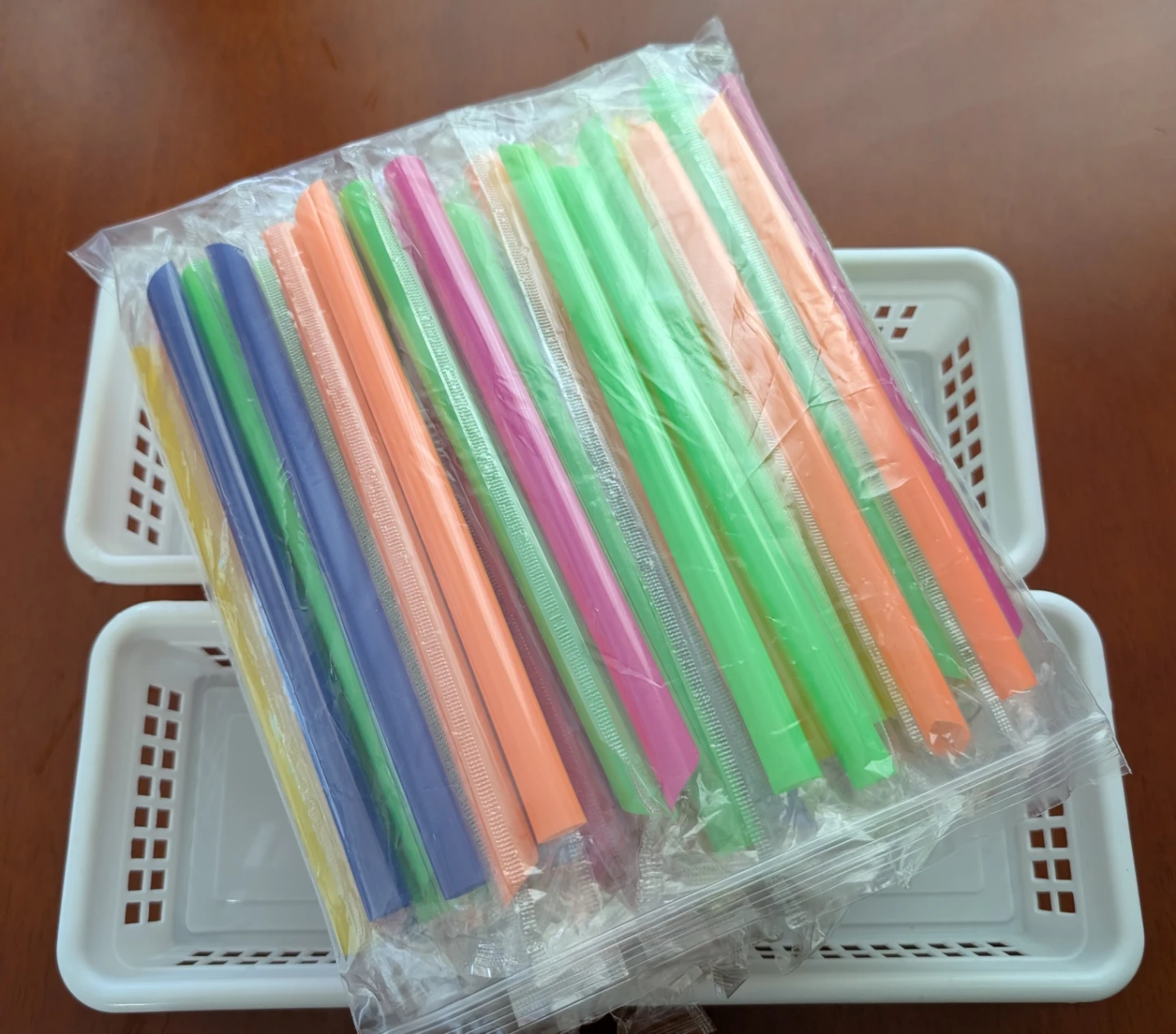 Bag of colourful plastic drinking straws