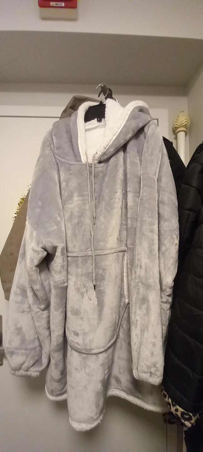 Box of brackets and a gray fleece cuddle coat. - photo 2