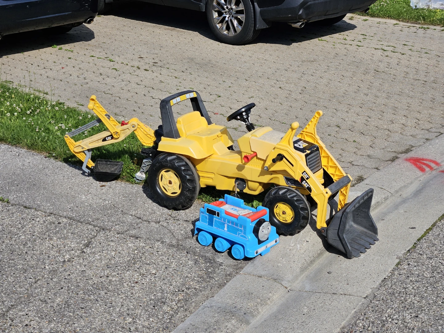Curb alert: Toddler CAT Pedal Ride-On Excavator