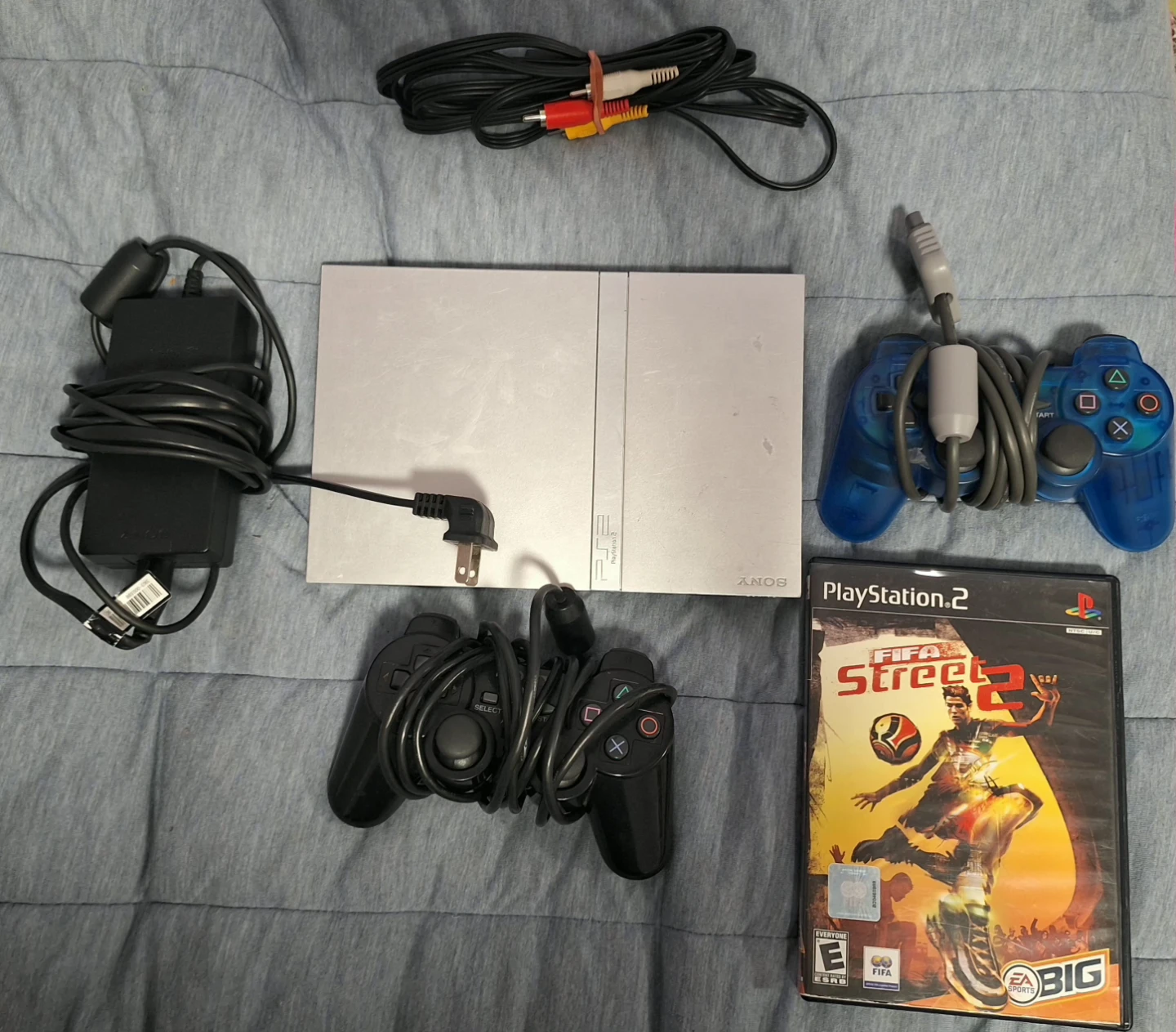 PlayStation 2 Console with FIFA Street 2 and Controllers