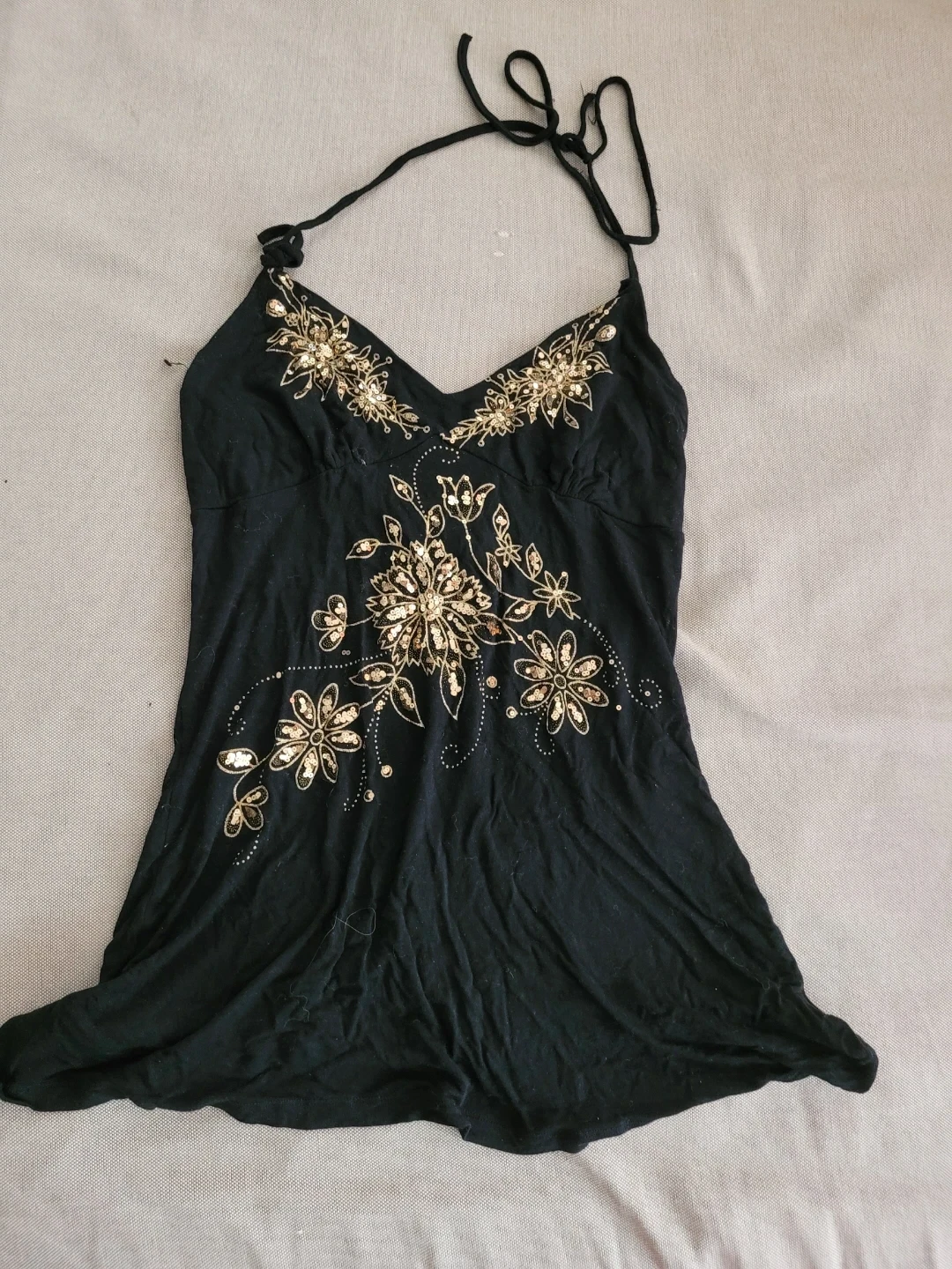 Black halter top with gold floral embellishments