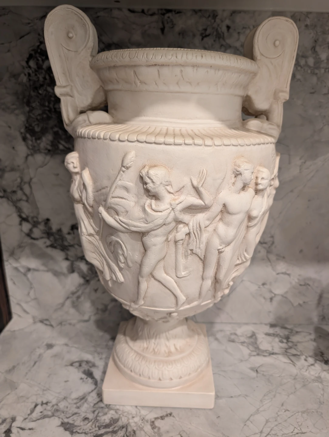 Decorative classical urn with relief figures