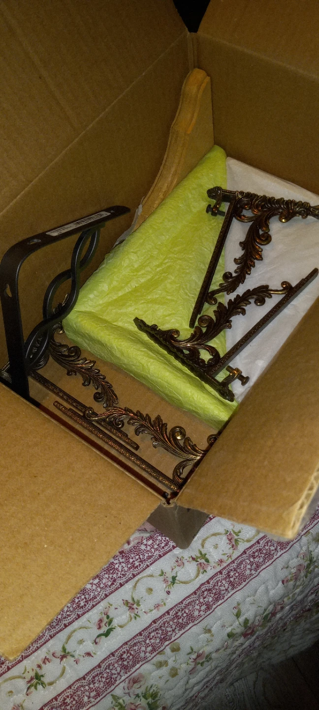 Box of brackets and a gray fleece cuddle coat.