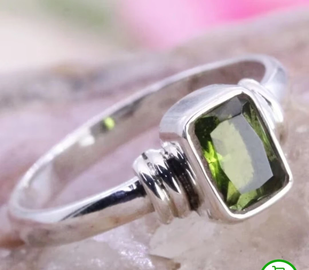 Silver ring with green gemstone