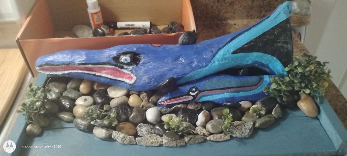 Driftwood sculpture with painted marine life