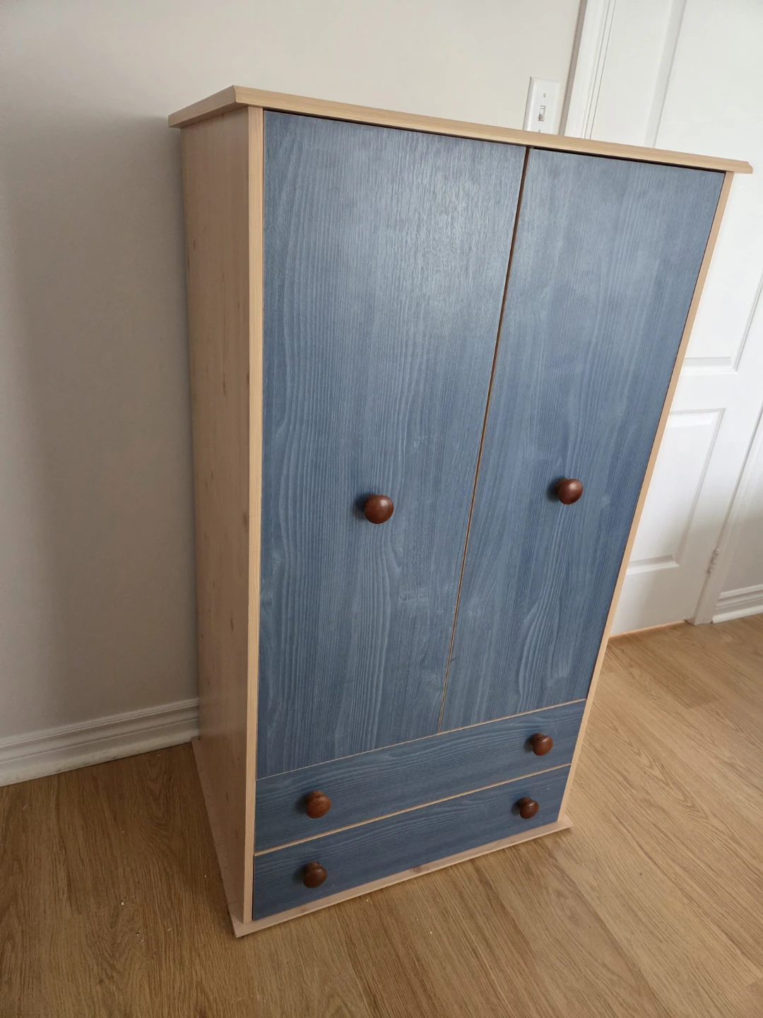 Blue and wood two-door cabinet with drawers