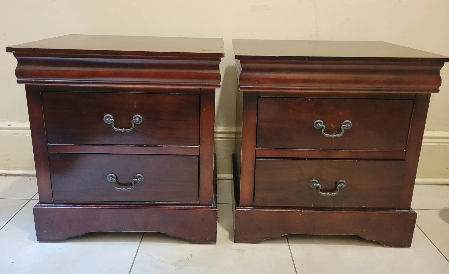 Two vintage dark wood nightstands with drawers