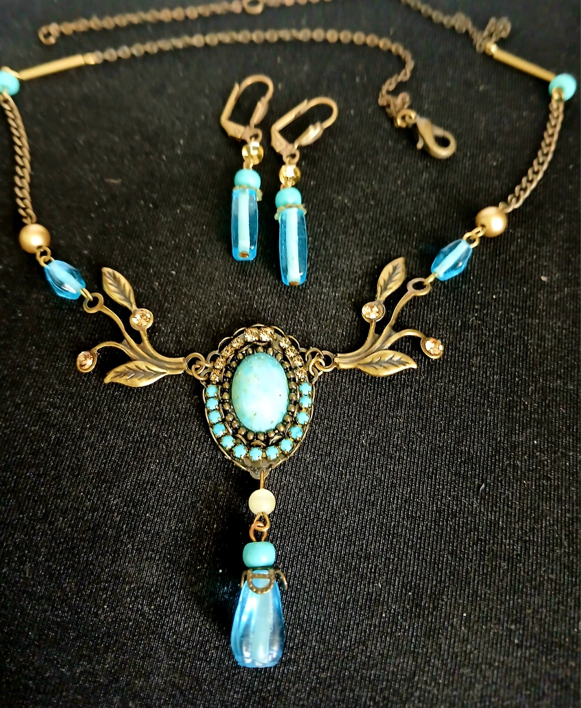 Turquoise and gold tone necklace and earring set