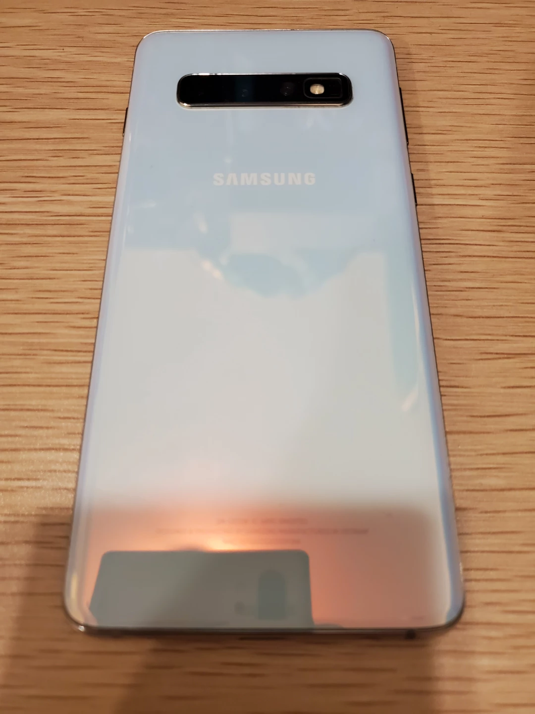 Galaxy S10 phone pearl white w spigen case