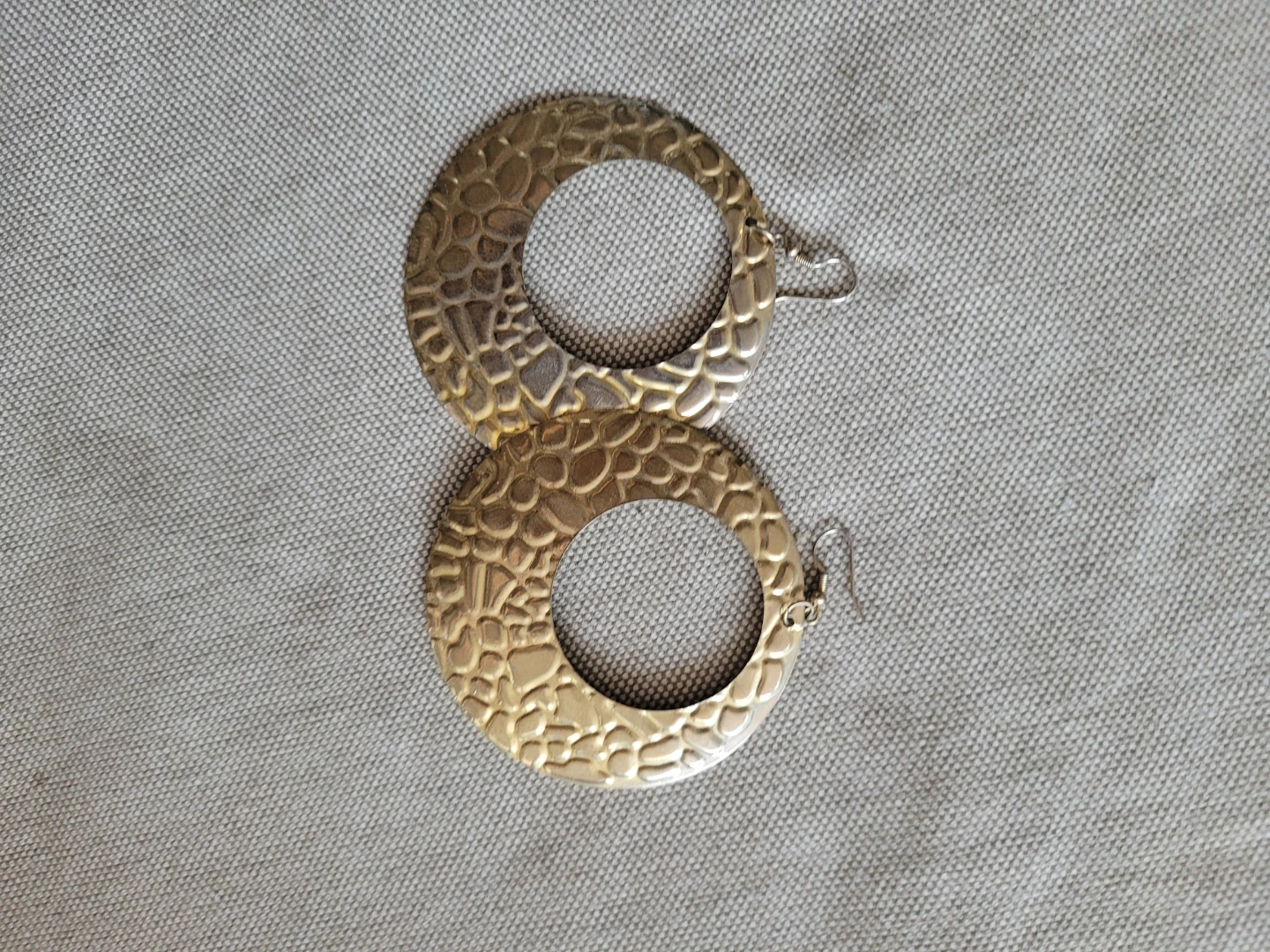 Gold coloured statement hoop earrings