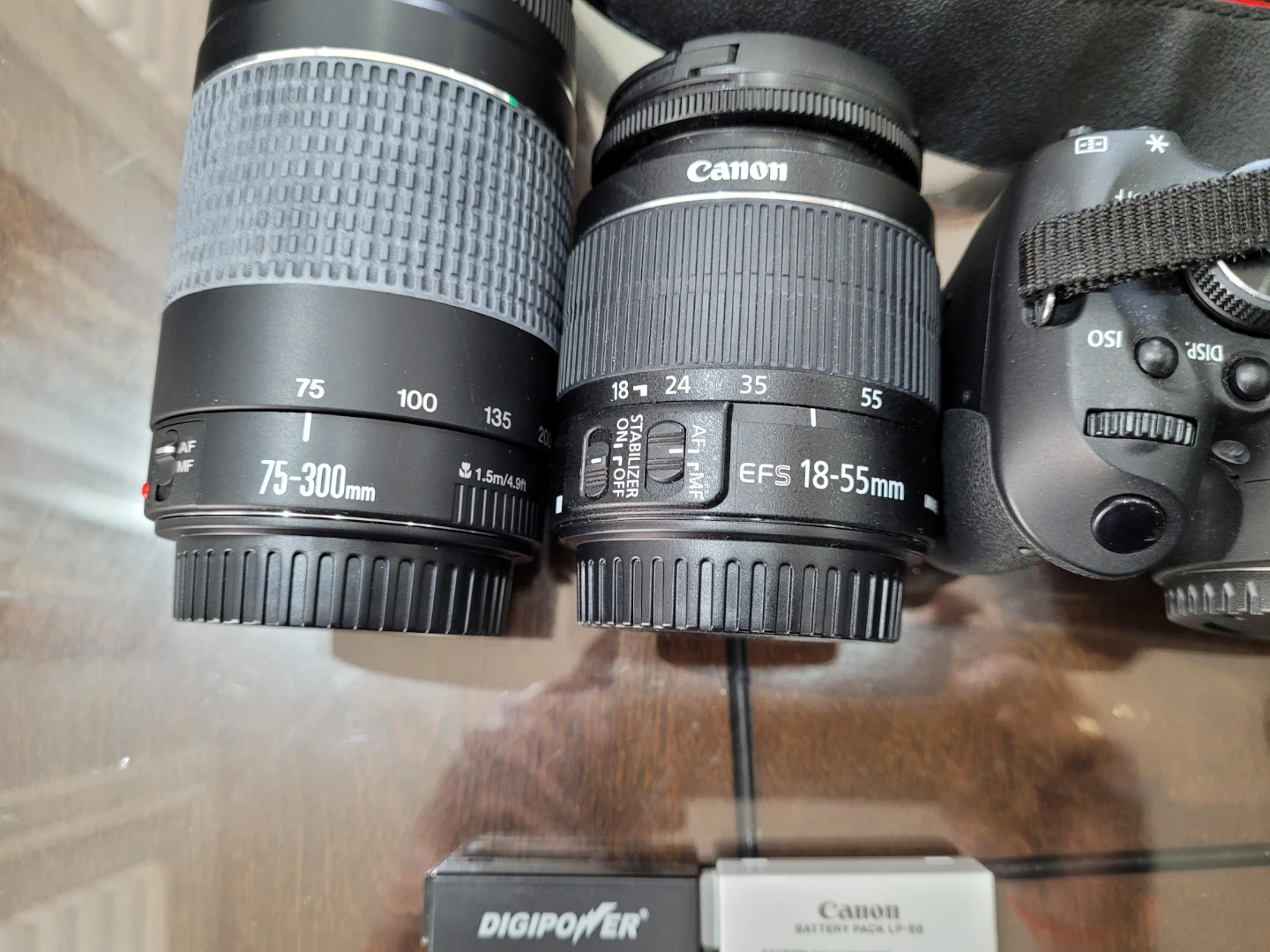 Canon eos rebel t3i DSLR with accessories and tripod.