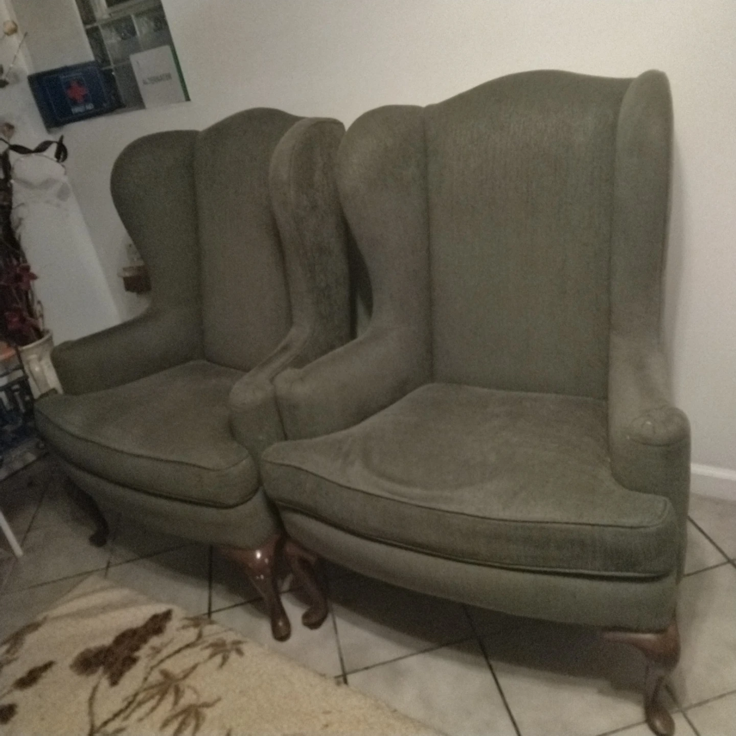 Two Green Wingback Chairs