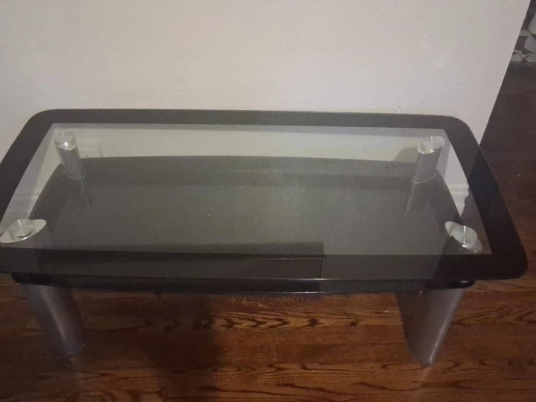 Glass top end table with metal legs