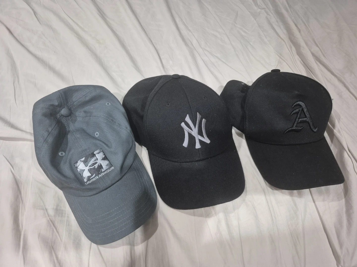 Under Armour, New York Yankees, and Black 'A' Caps - 3 Pack