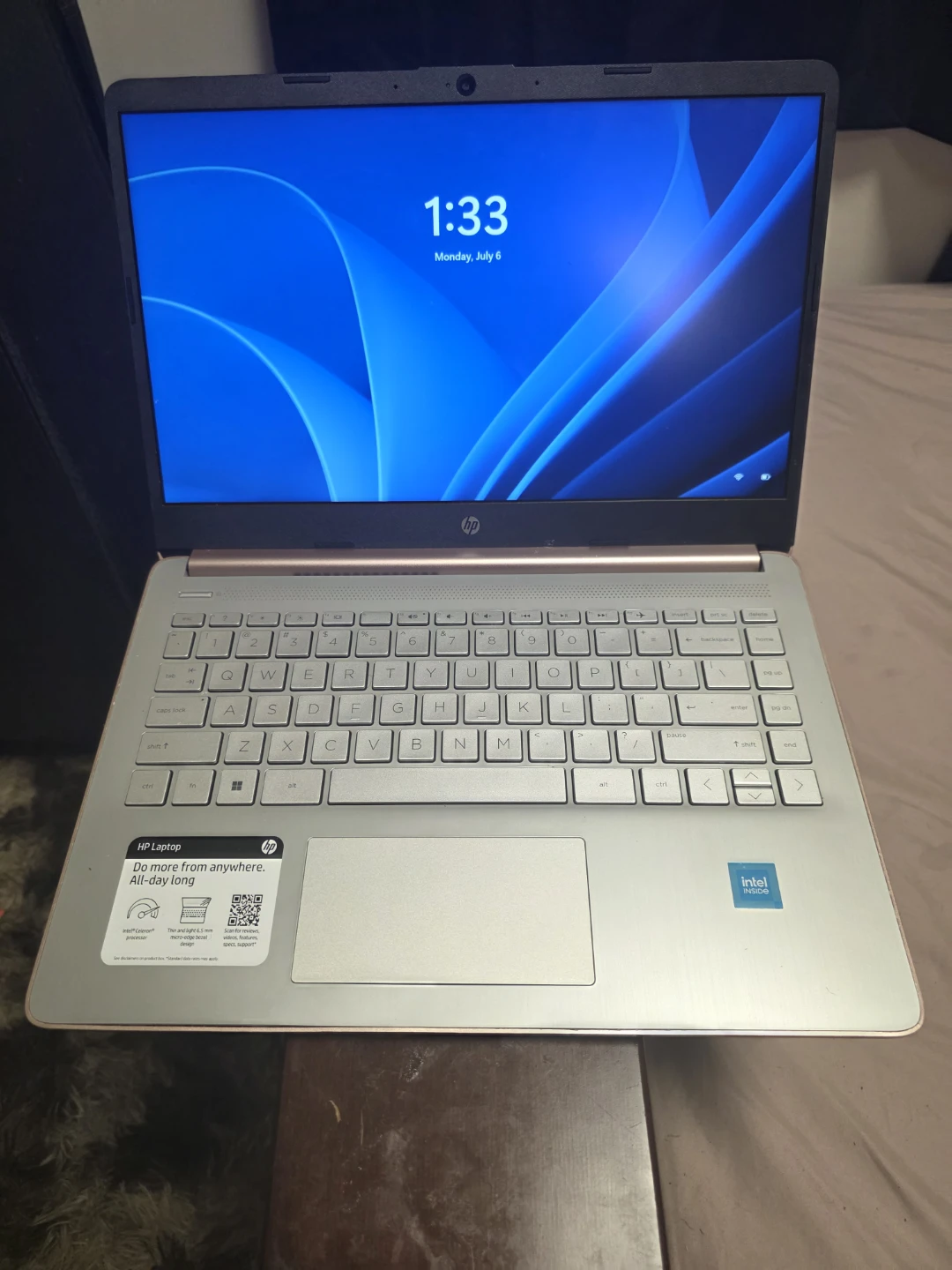 Apple iPad, HP laptops, and PlayStation 5 with games