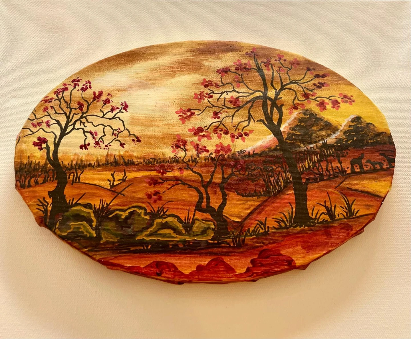 Two hand drawn oval landscape paintings