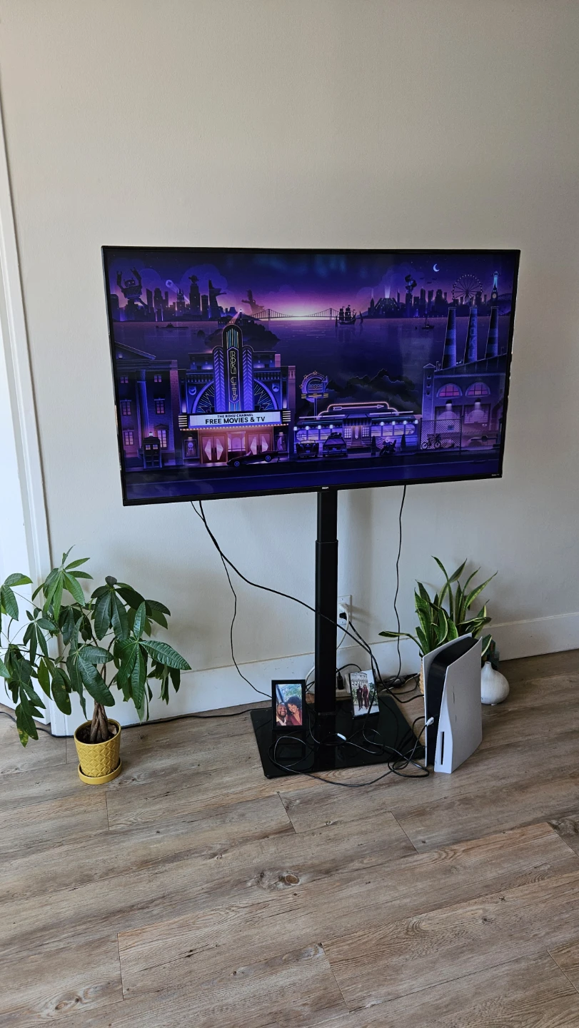 RCA 55” 4K UHD Roku Smart TV + Adjustable TV Stand