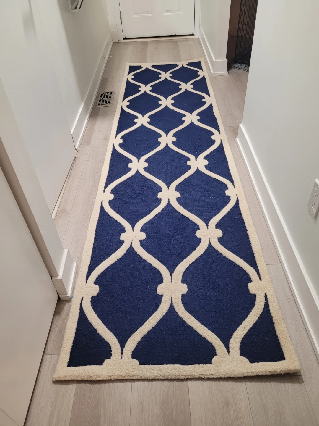 Blue and cream patterned runner rug