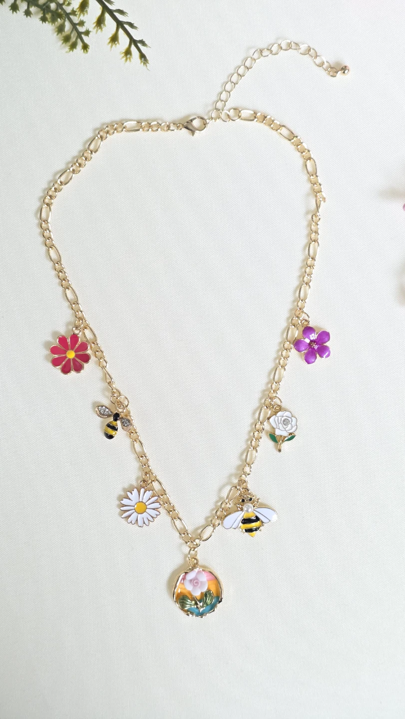 Gold Tone Necklace with Bee and Flower Charms