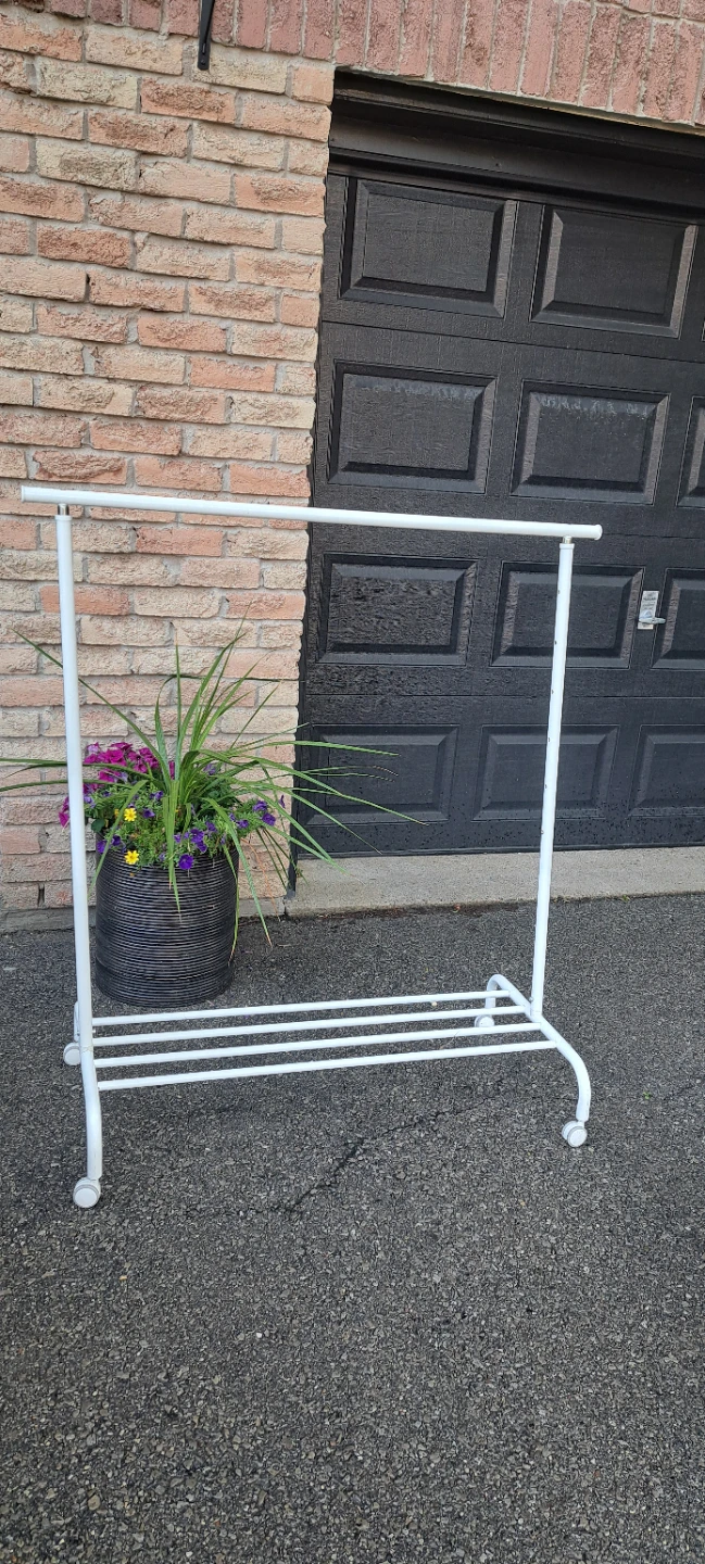 White Rolling Clothes Rack. Located in Mississsuga