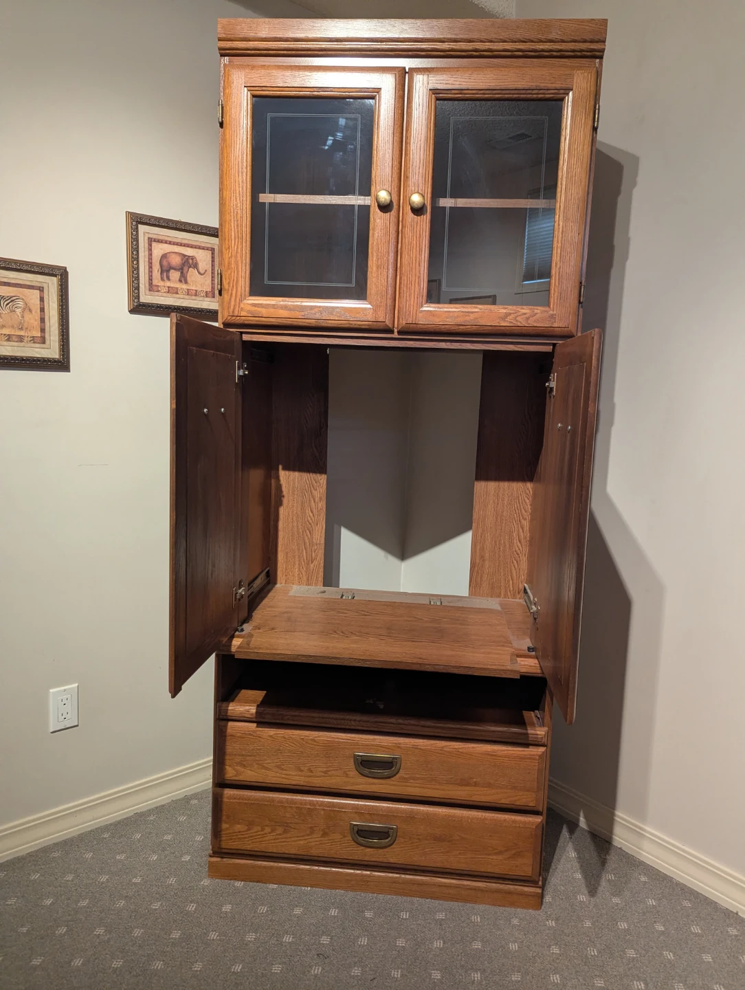 Wooden media cabinet with glass doors and drawers