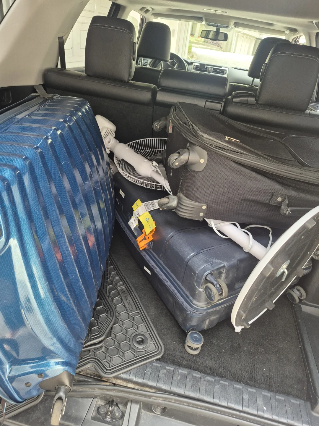 Three full-size suitcases