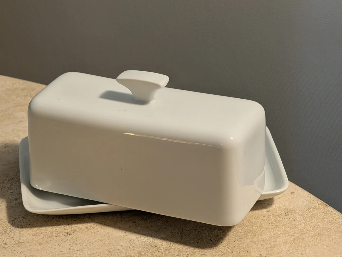 White ceramic butter dish with lid