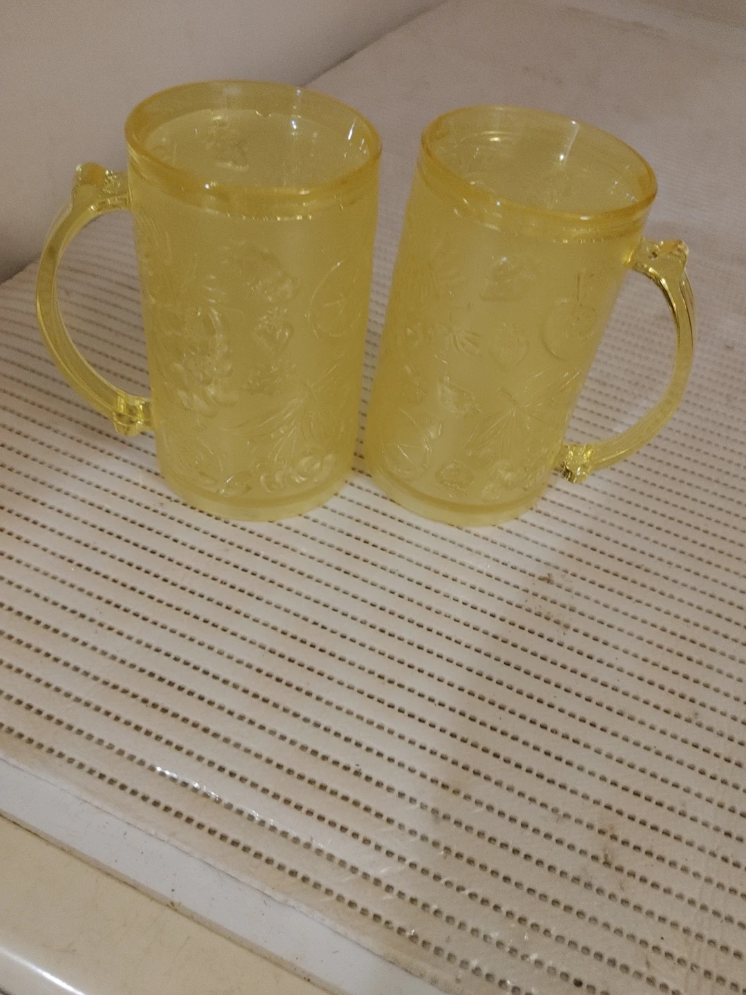 Set of 2 Yellow Embossed Plastic Mugs