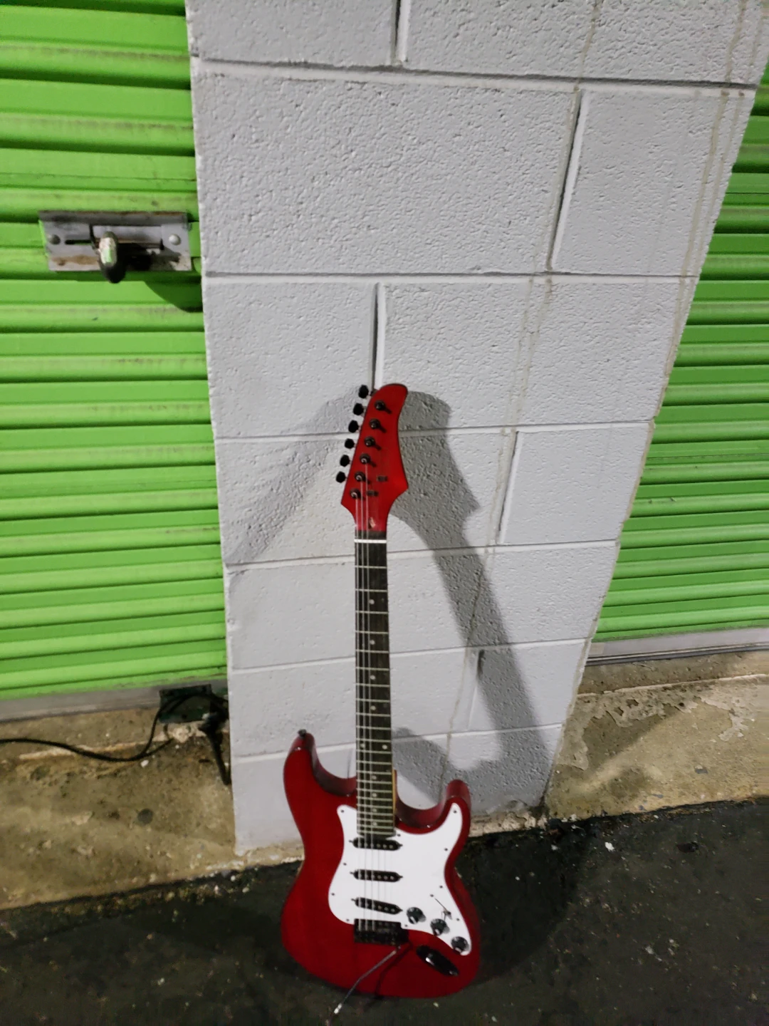 Red Electric Guitar with Amplifier
