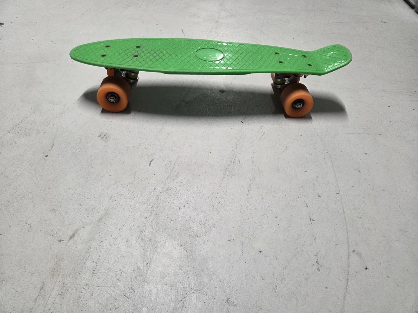 Green Skateboard with Orange Wheels
