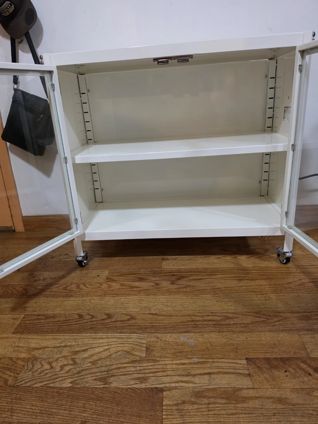 White Storage Cabinet with Glass Doors and Wheels - photo 2