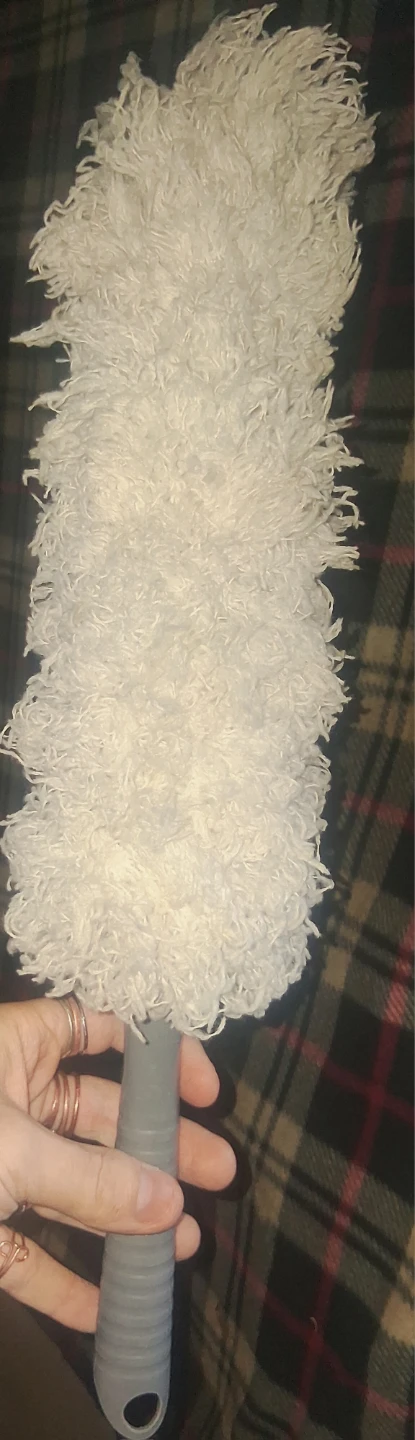 White fluffy duster
