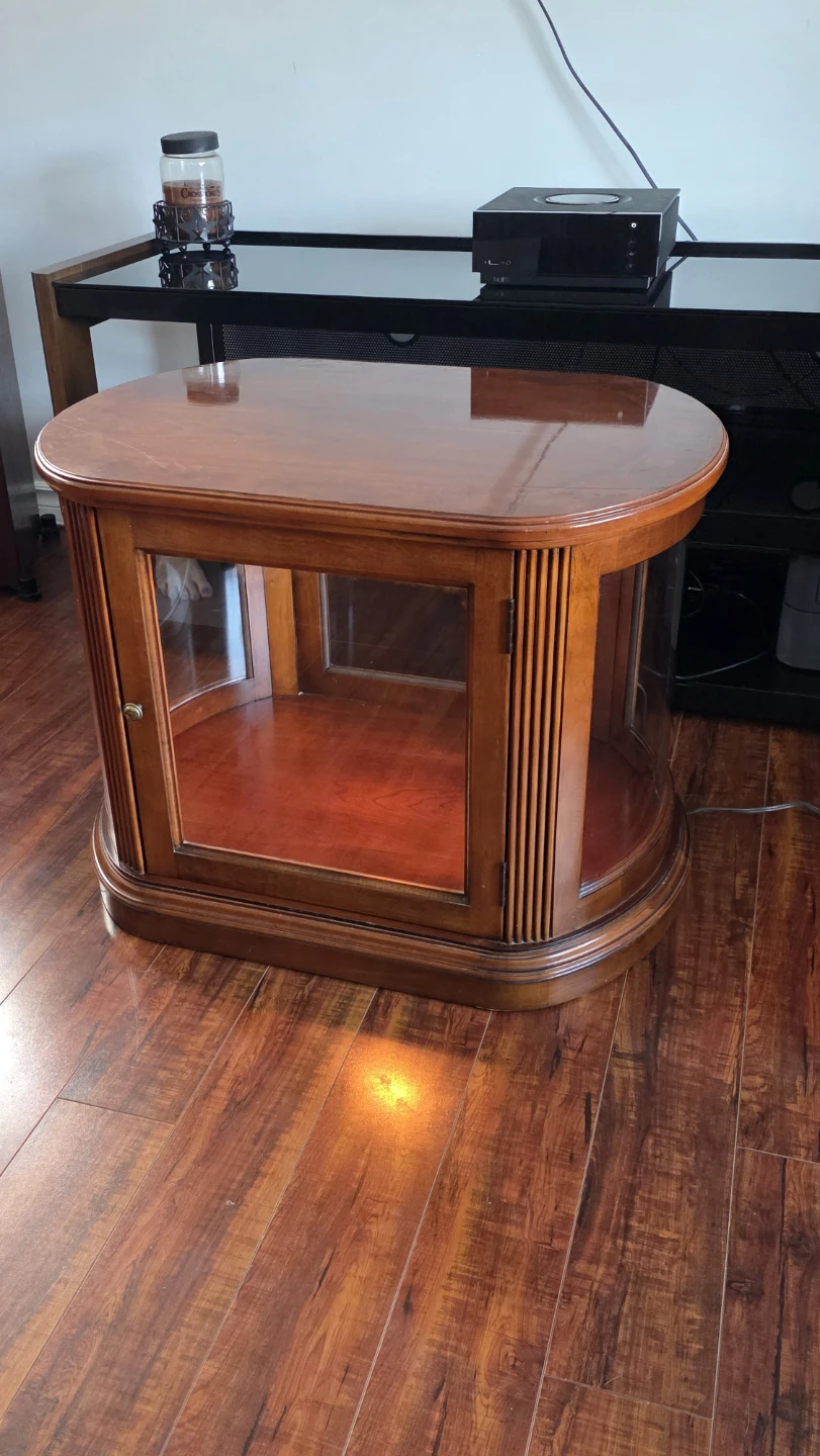 Wooden display table with glass doors