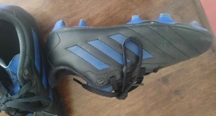 Used size 1 kids soccer shoes