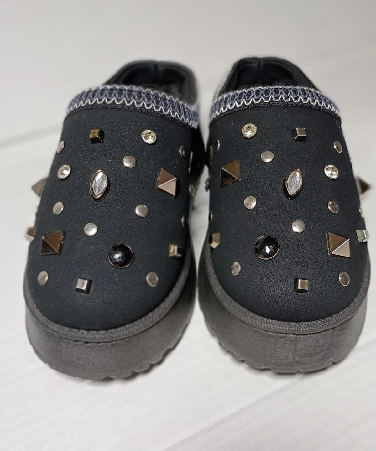 Black embellished mules with faux fur lining