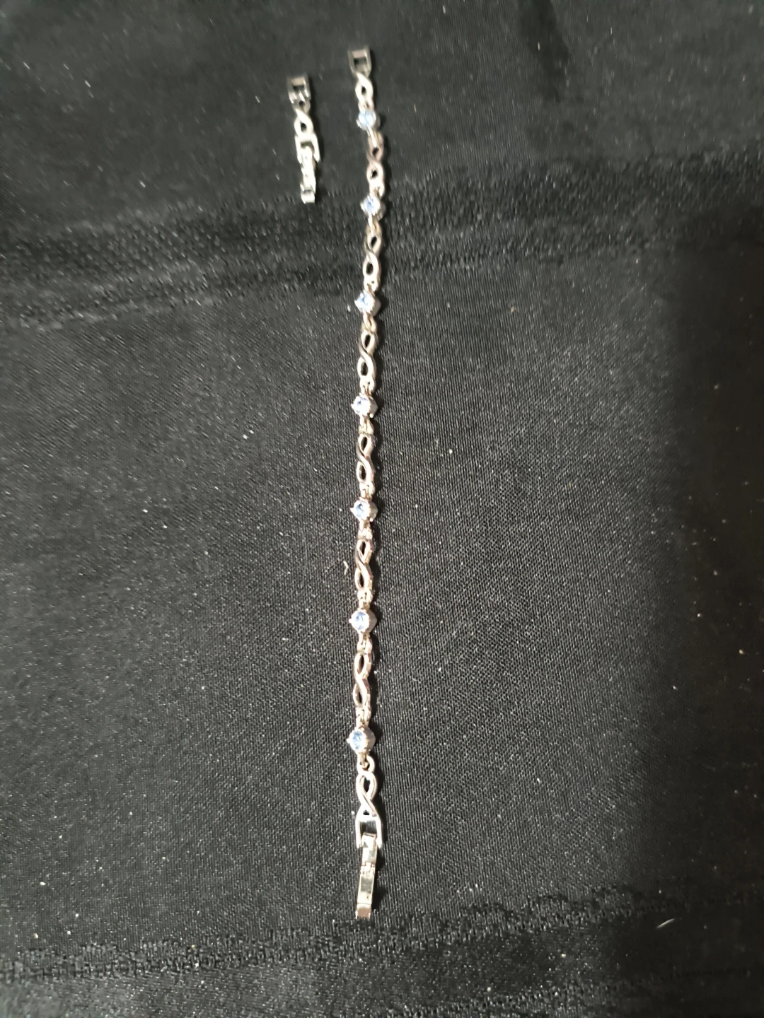 Silver-tone bracelet with blue accents