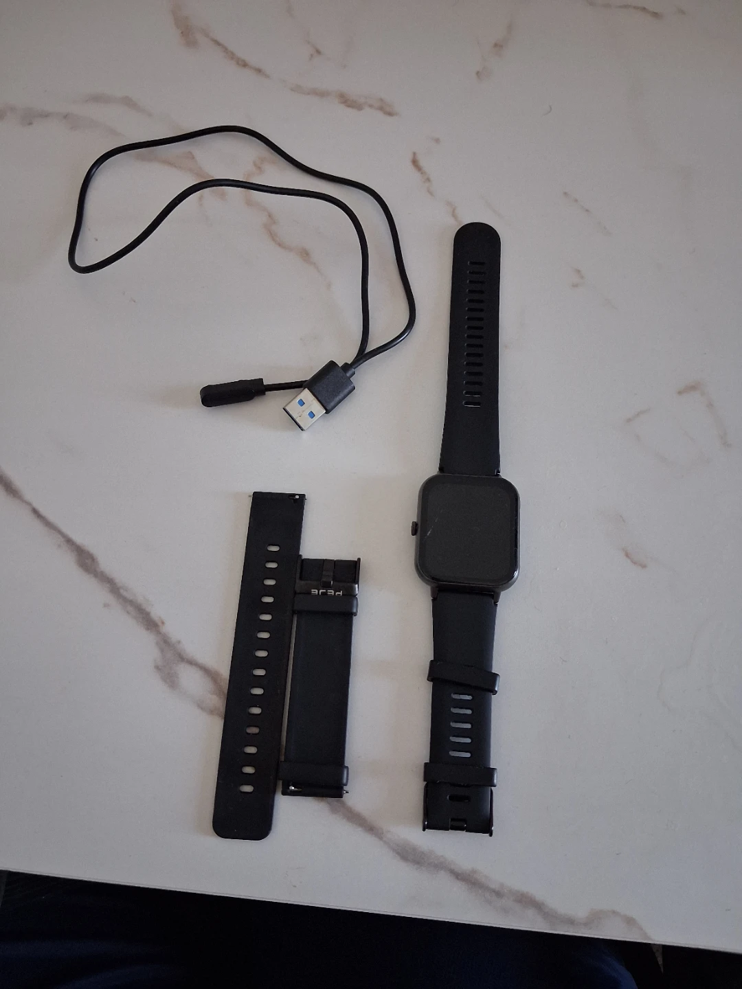 Black PEJE Fitness Tracker Smartwatch with Charger
