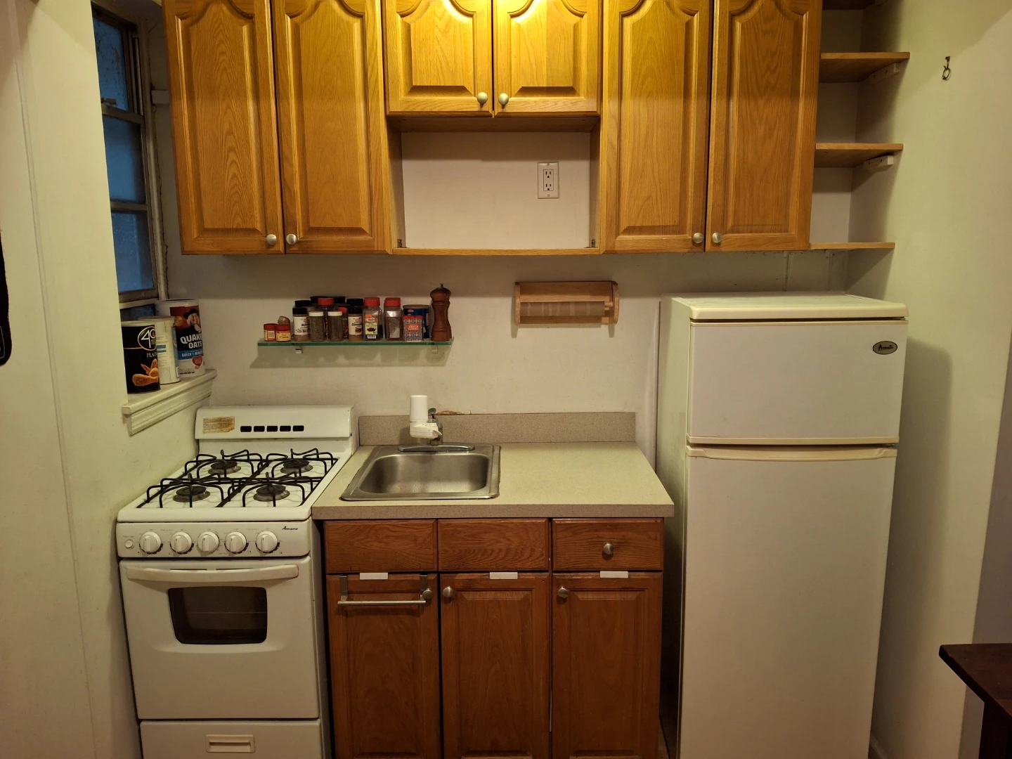 Kitchen cabinets, sink ans faucet.