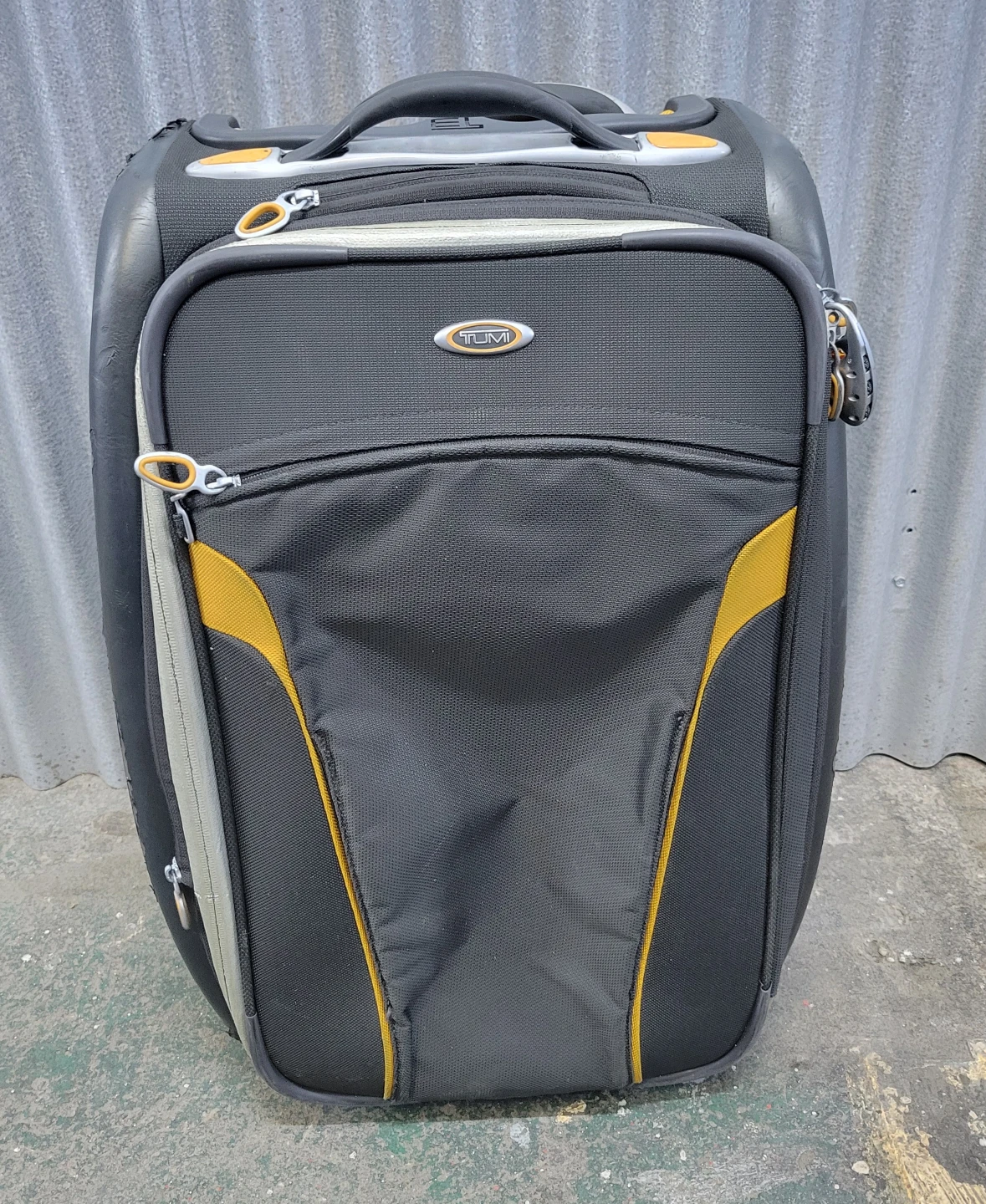 Tumi Black & Yellow Rolling Suitcase