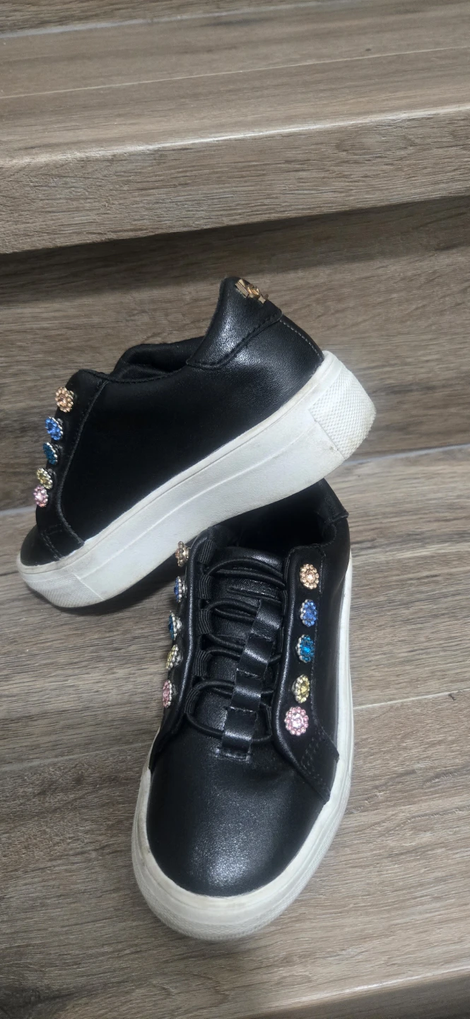 Black embellished sneakers