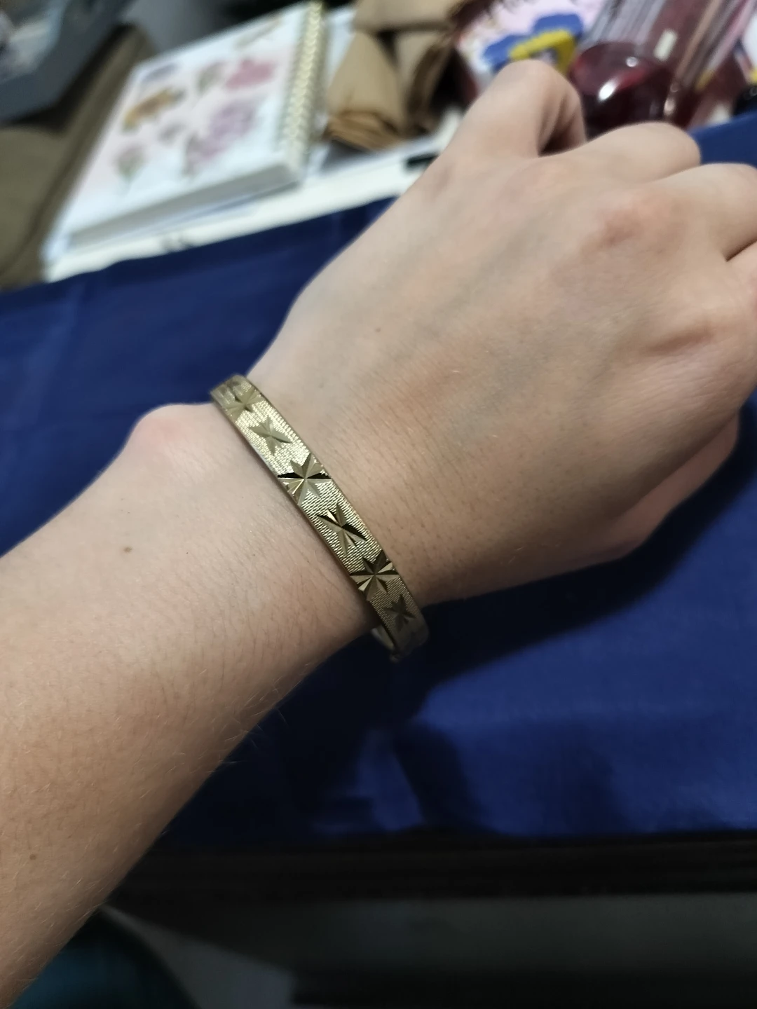 Gold Tone Bangle Bracelet with Star Design