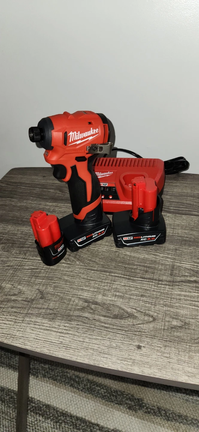 M12 Milwaukee subcompact impact driver& batteries