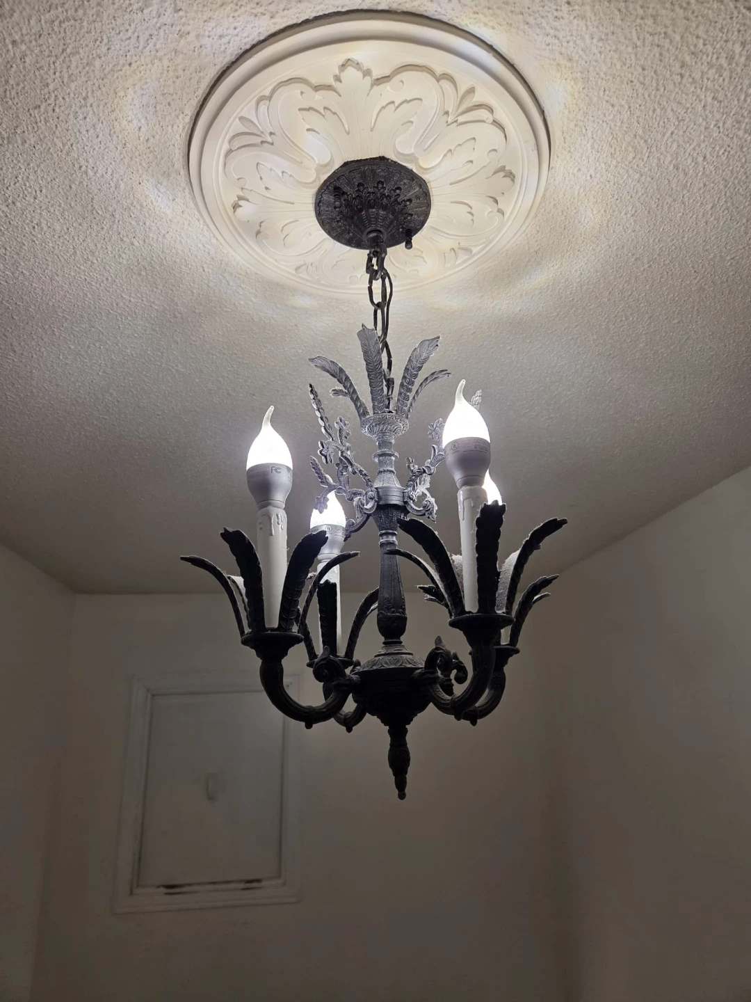 Vintage Brass 4-Light Chandelier painted black. Approx 16" tall.