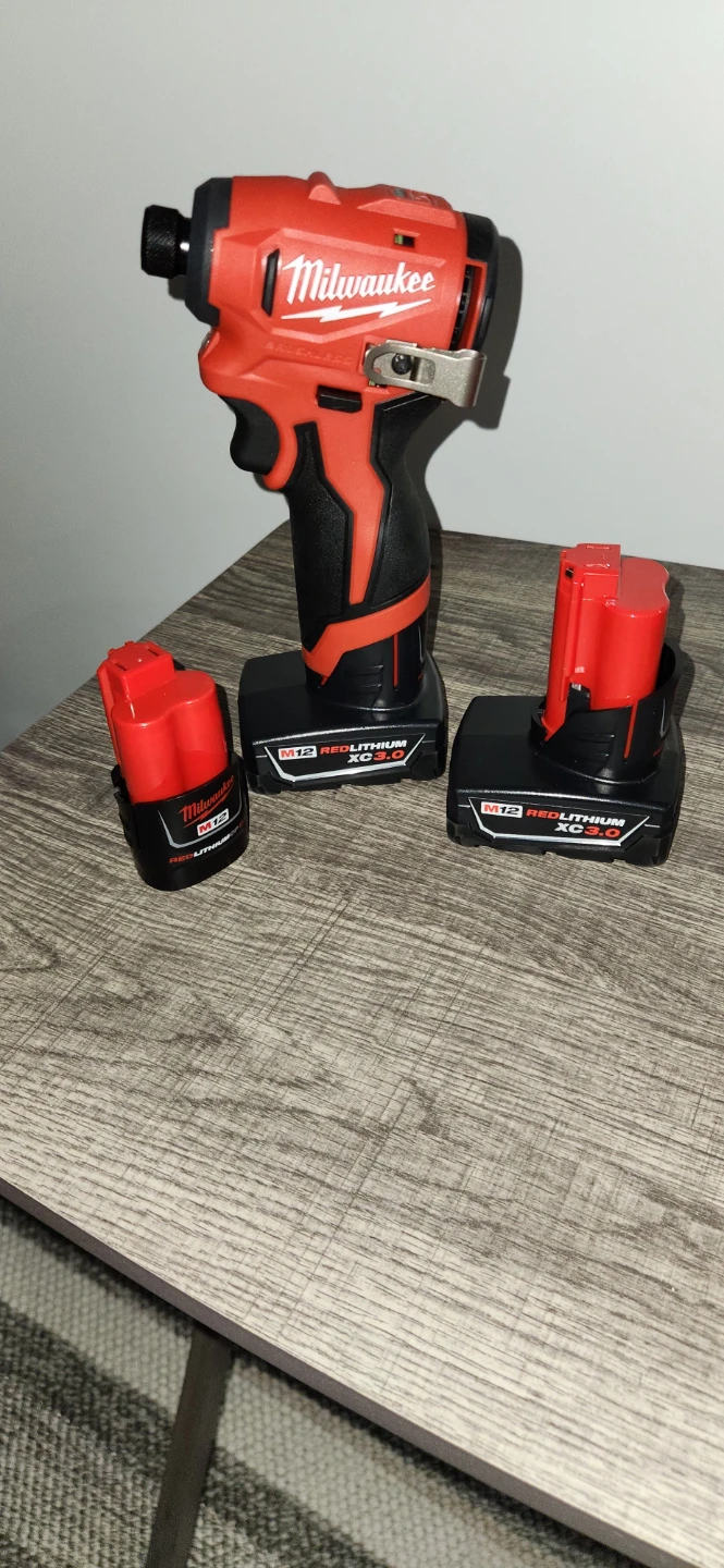 M12 Milwaukee subcompact impact driver& batteries - photo 2