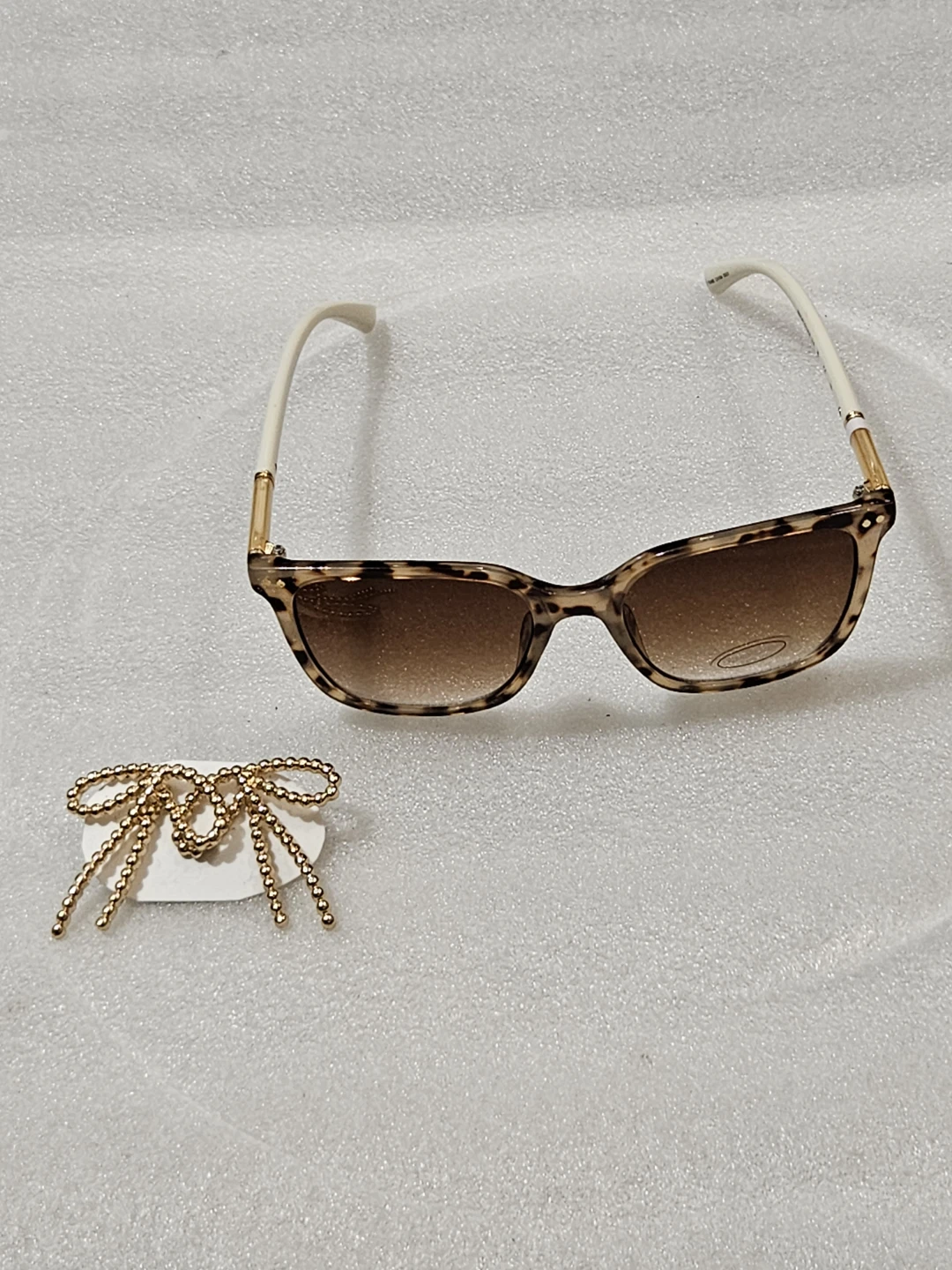 Bebe Leopard Print Sunglasses with Gold Bow Detail